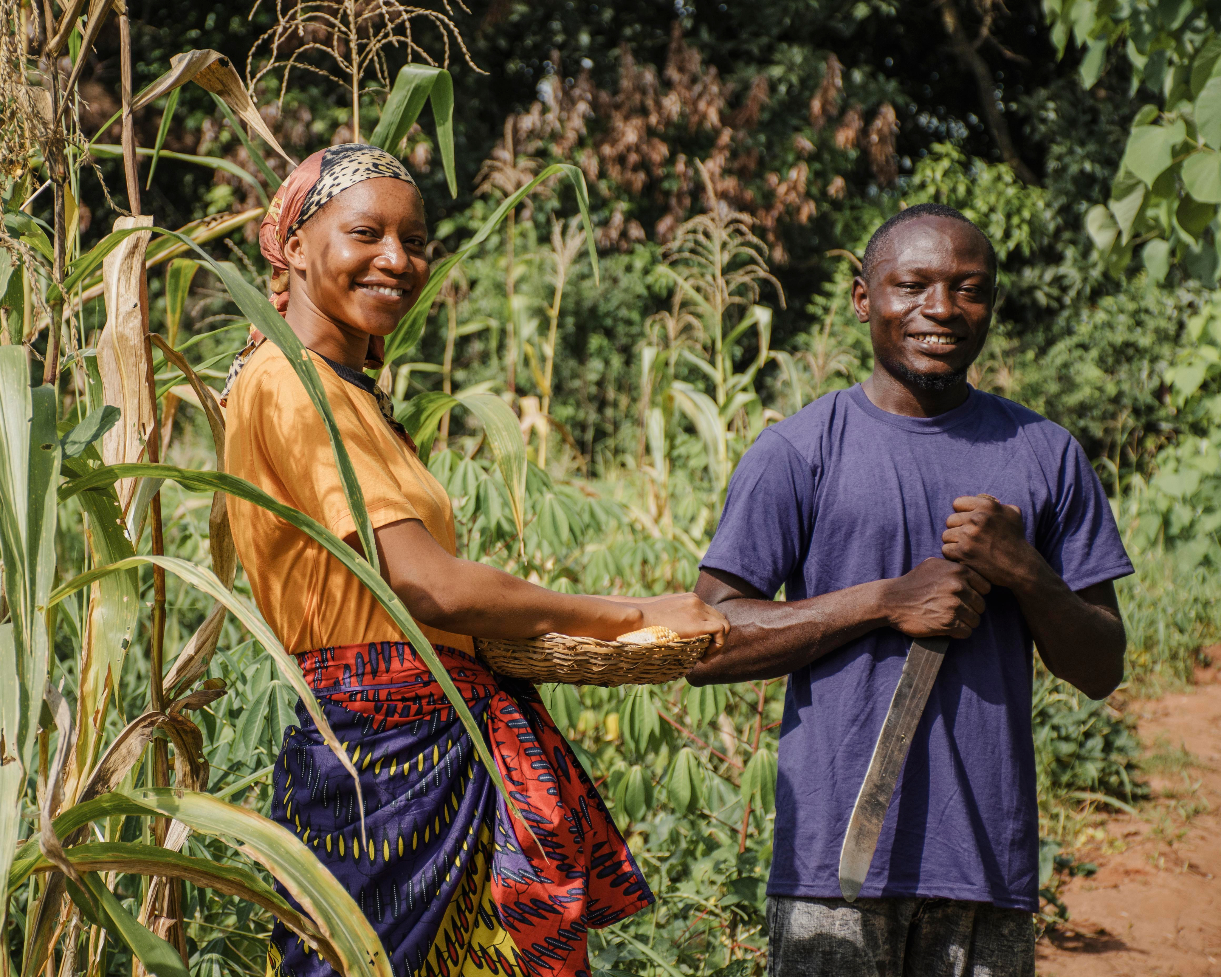 Farmers standing in a crop field